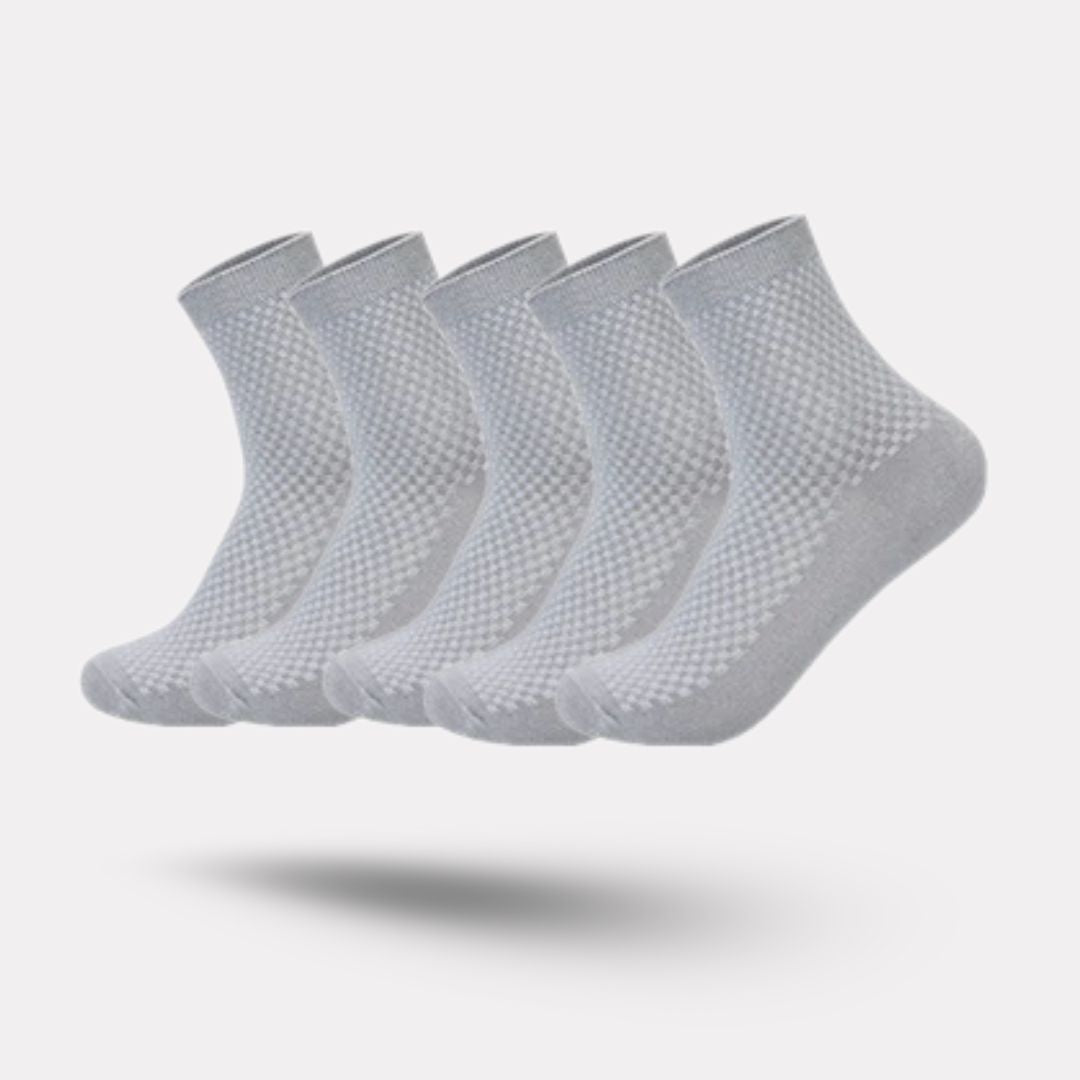 Bamboo fiber crew socks worn at the ankle, in five-pair packs of black, gray or navy