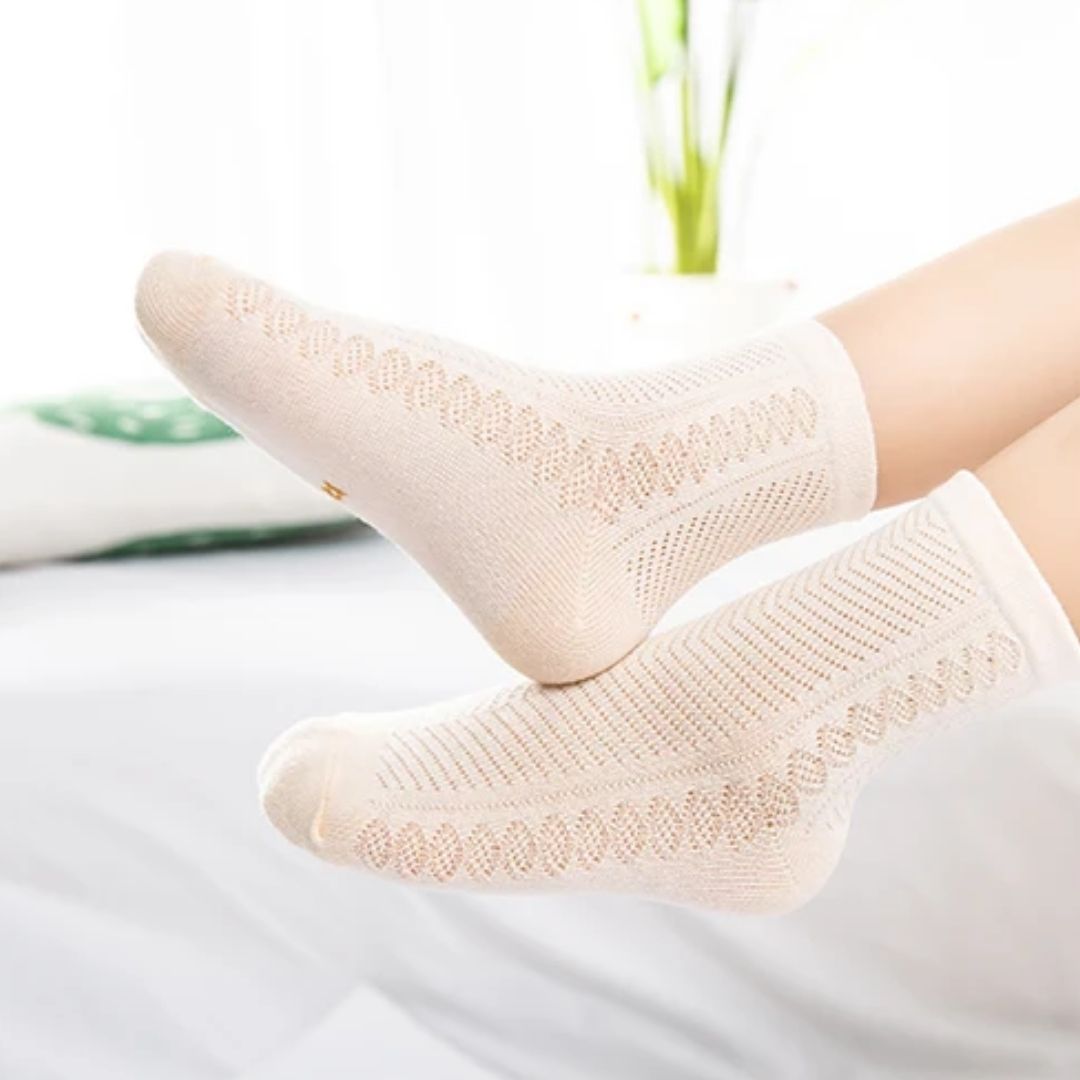 Four pairs of soft breathable cotton socks for children, worn on the foot and ankle
