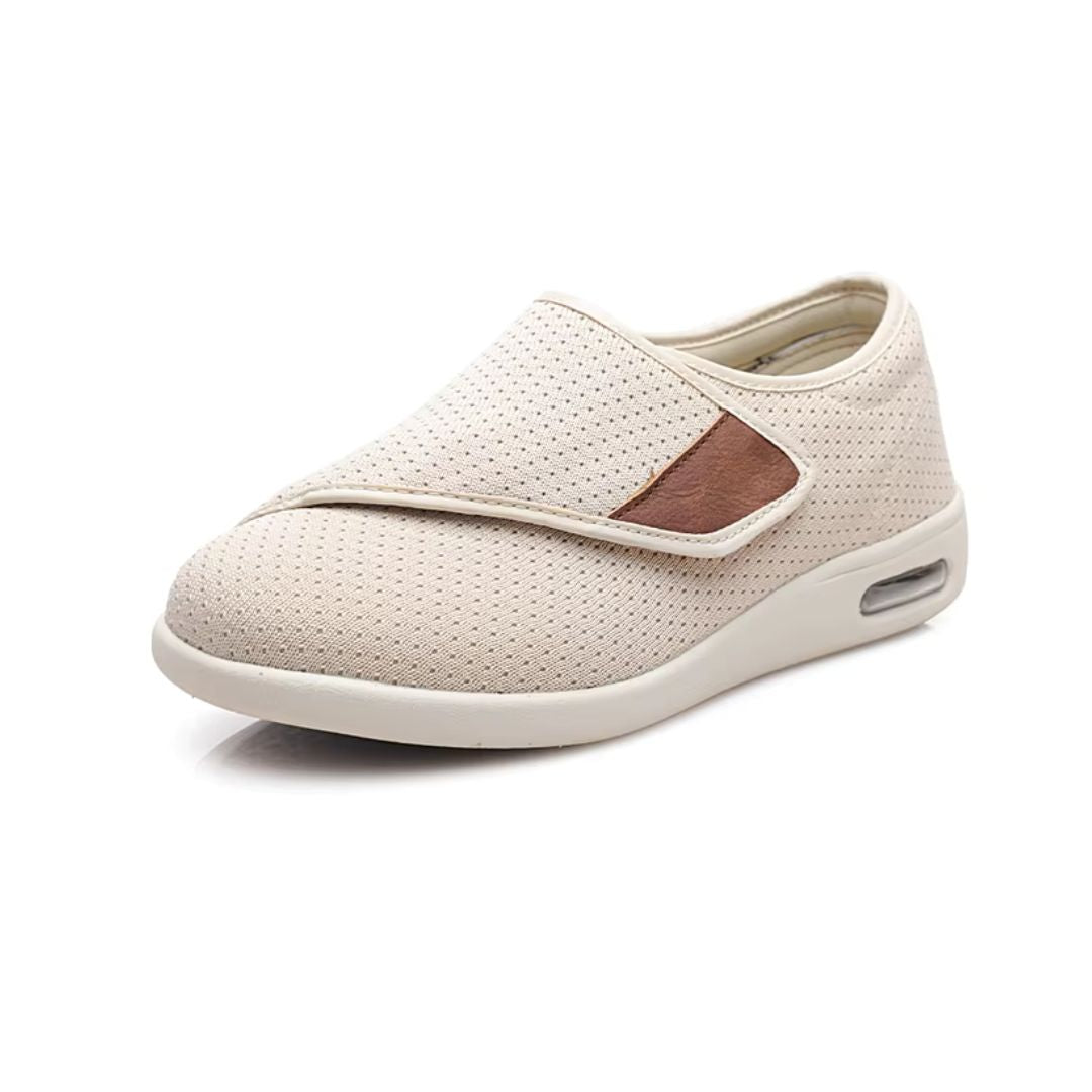 Women's orthopedic shoes closed by a hook-and-loop strap across the instep