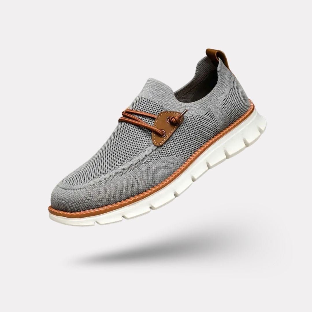 Gray casual orthopedic shoes for men with a lace-up front and thick cushioned sole