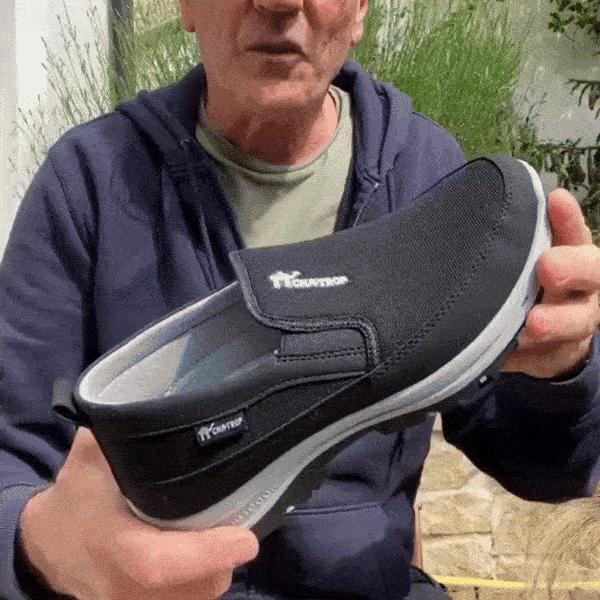 Black orthopedic walking shoes for men with a cushioned midsole and lace-up fit