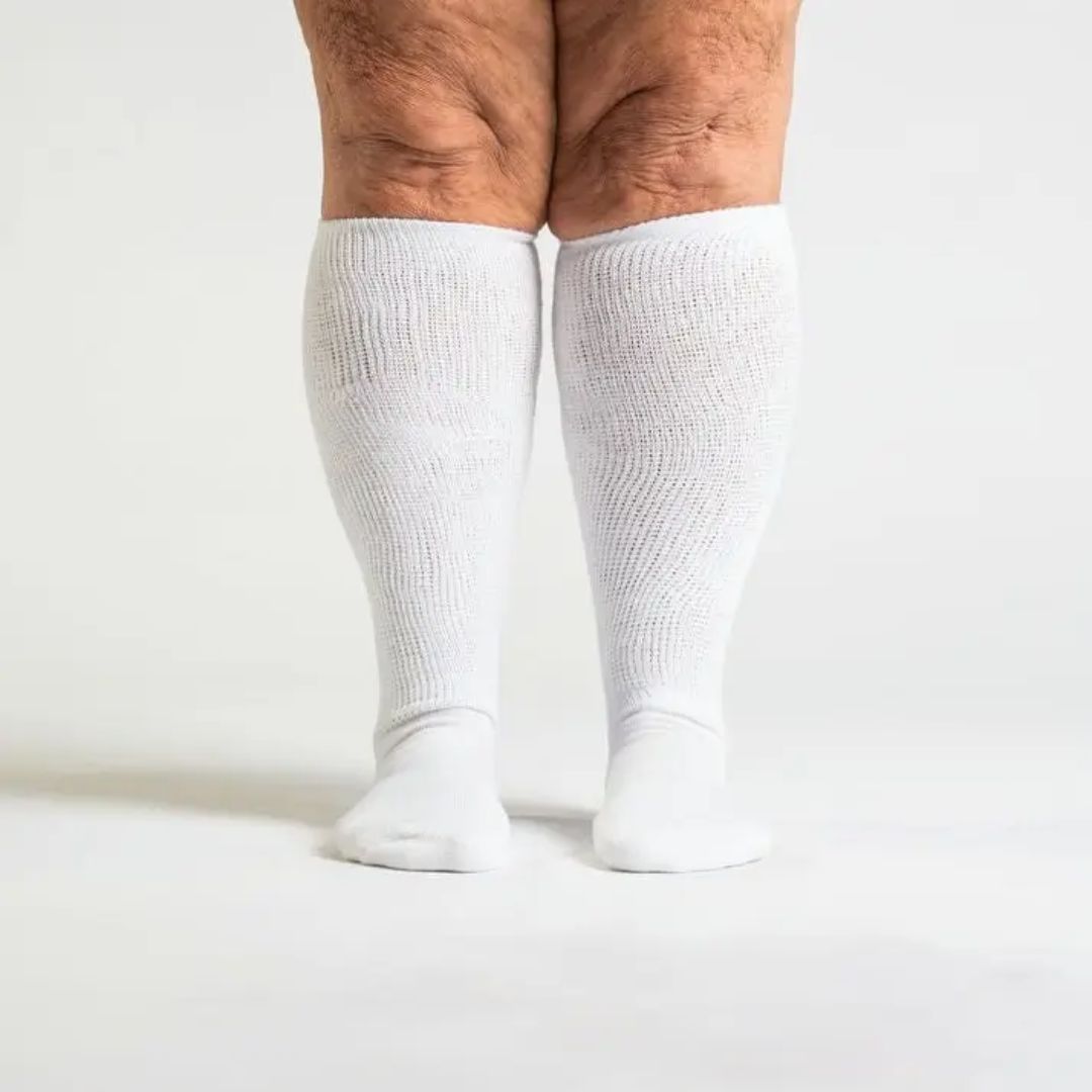 Black compression socks cut for wide calves with a graduated knit
