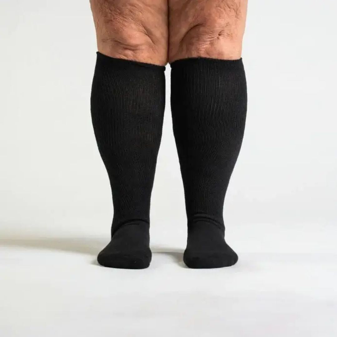 Black compression socks cut for wide calves with a graduated knit