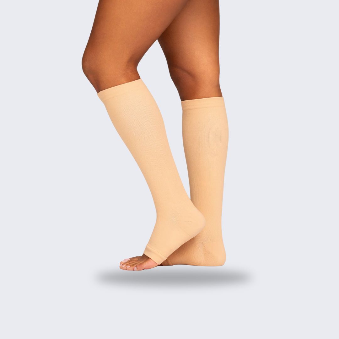 Breathable open-toe compression socks in black and beige, worn up the calf
