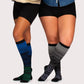 Two-tone 20-30 mmHg compression socks worn up the calf, in black, pink, blue and light blue