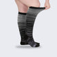Two-tone 20-30 mmHg compression socks worn up the calf, in black, pink, blue and light blue