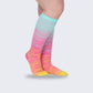 Two-tone 20-30 mmHg compression socks worn up the calf, in black, pink, blue and light blue