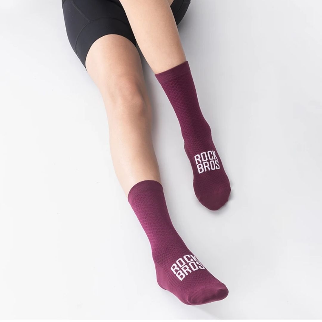 Pair of blue outdoor cycling socks ribbed at the calf with a snug footbed