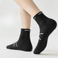 Black and white running socks in ankle and crew heights with a reinforced arch band
