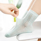 Four pairs of soft breathable cotton socks for children, worn on the foot and ankle