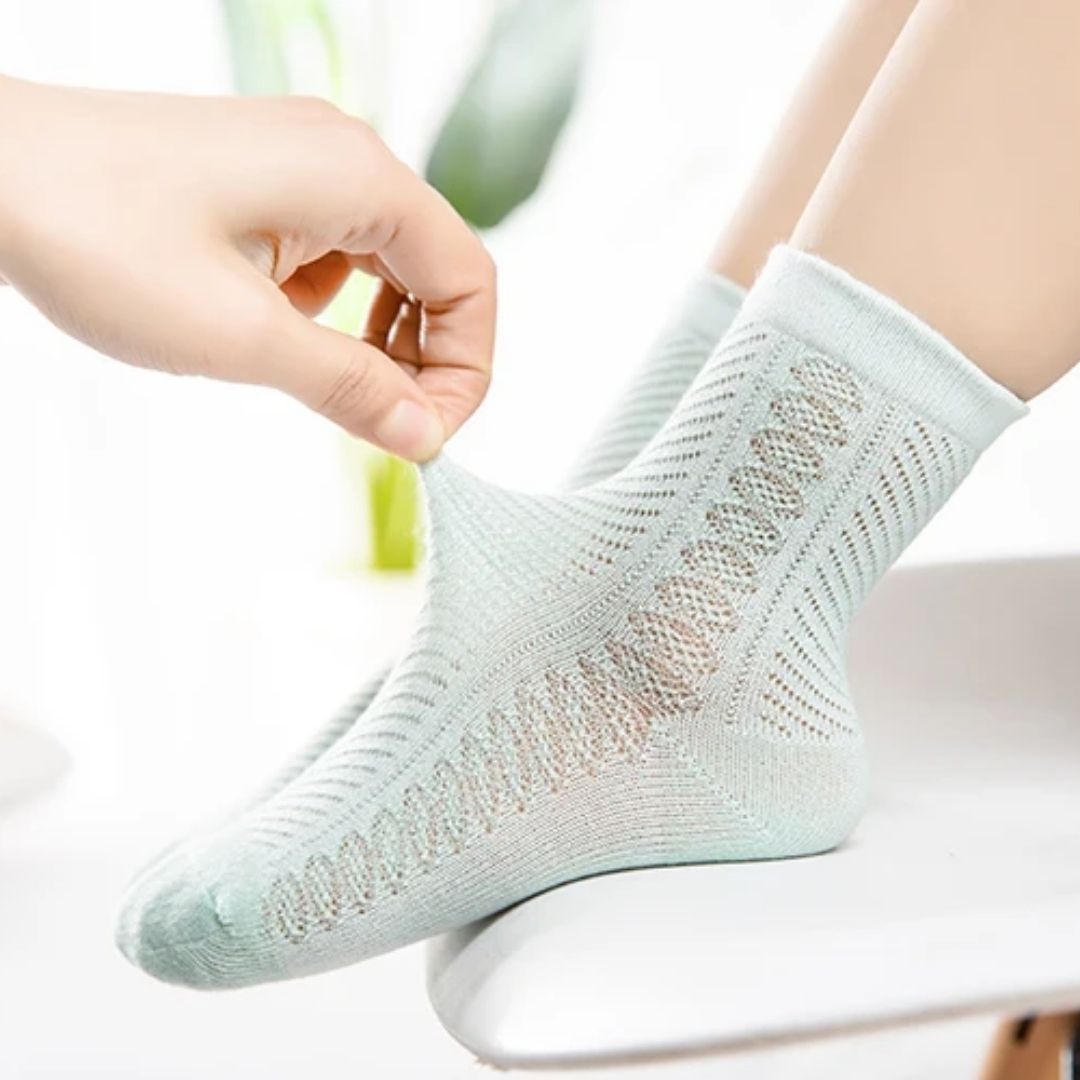 Four pairs of soft breathable cotton socks for children, worn on the foot and ankle