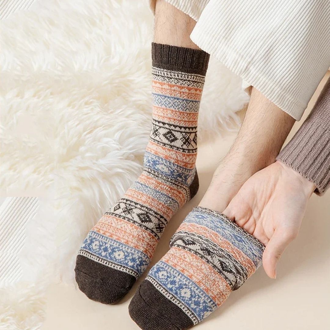 Four pairs of thick wool socks knitted to sit mid-calf for winter warmth