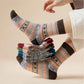 Four pairs of thick wool socks knitted to sit mid-calf for winter warmth