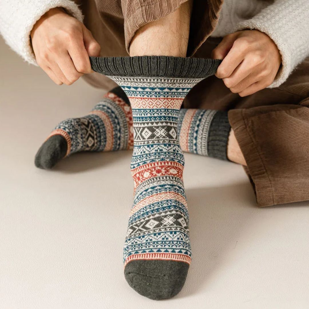 Four pairs of thick wool socks knitted to sit mid-calf for winter warmth