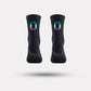 Black cycling socks with reflective stripes, worn high on the calf