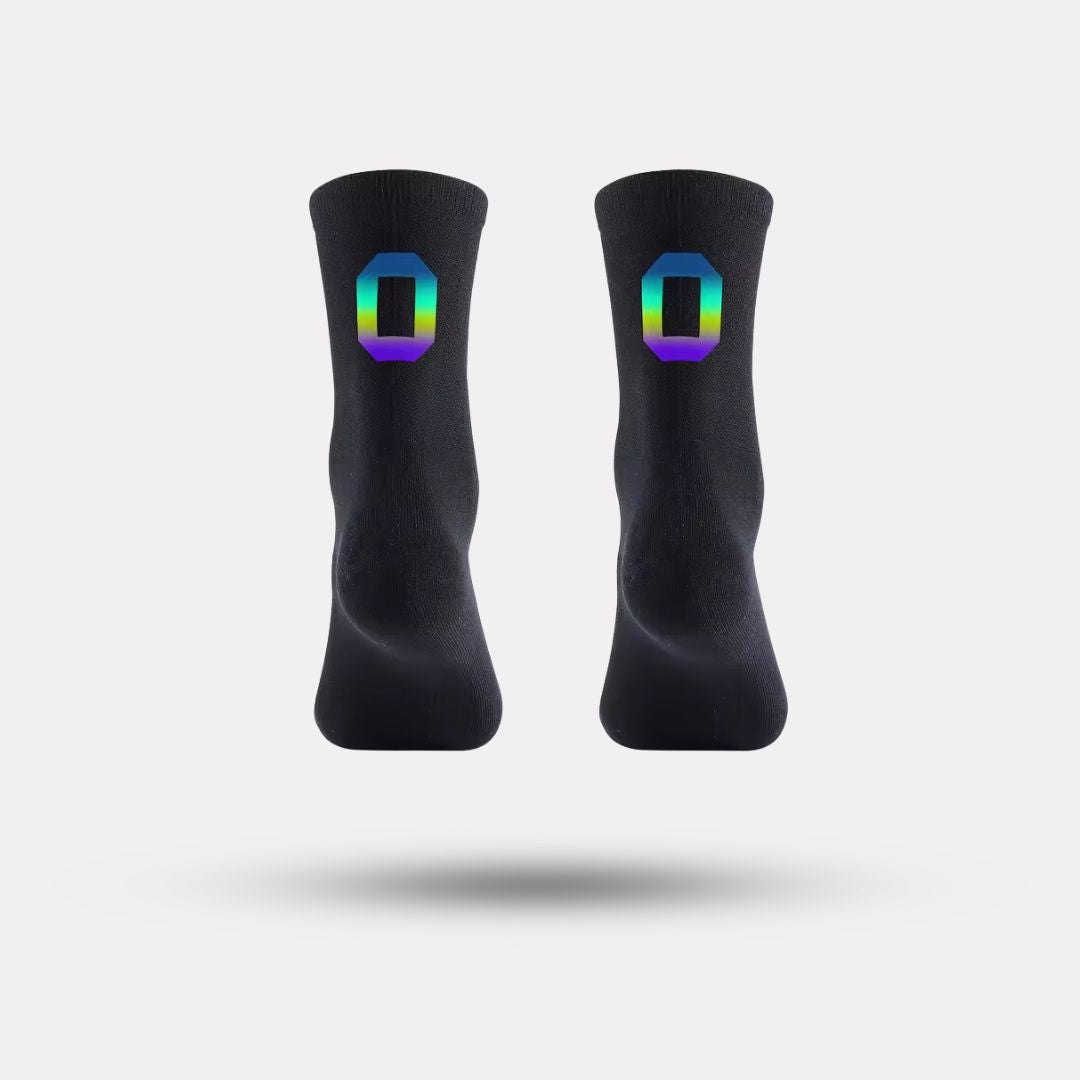 Black cycling socks with reflective stripes, worn high on the calf