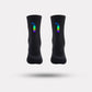 Black cycling socks with reflective stripes, worn high on the calf