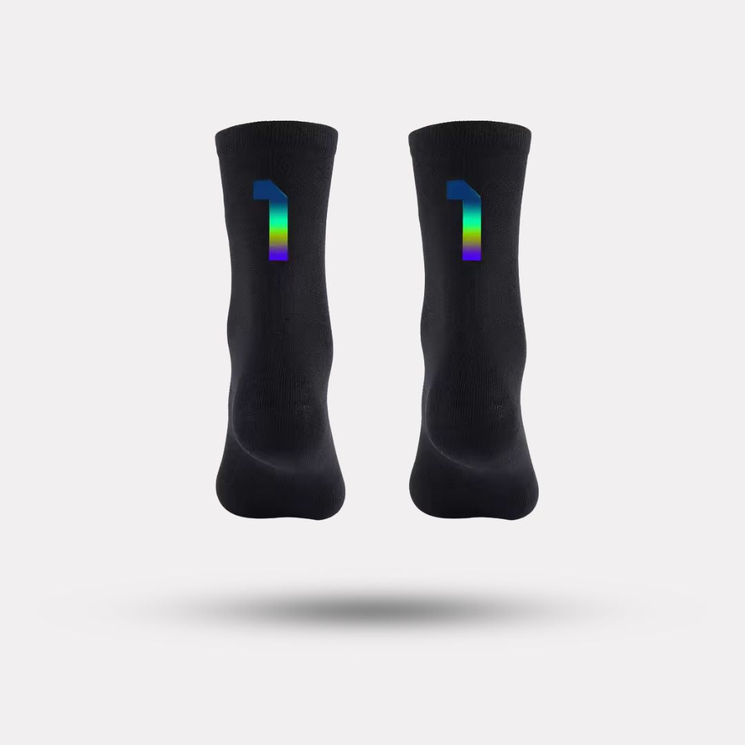 Black cycling socks with reflective stripes, worn high on the calf