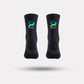 Black cycling socks with reflective stripes, worn high on the calf