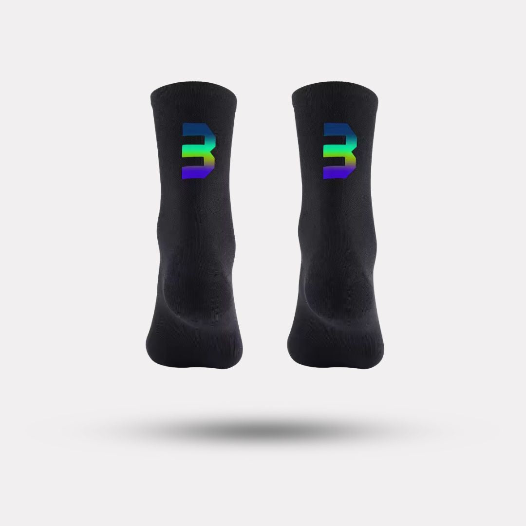 Black cycling socks with reflective stripes, worn high on the calf
