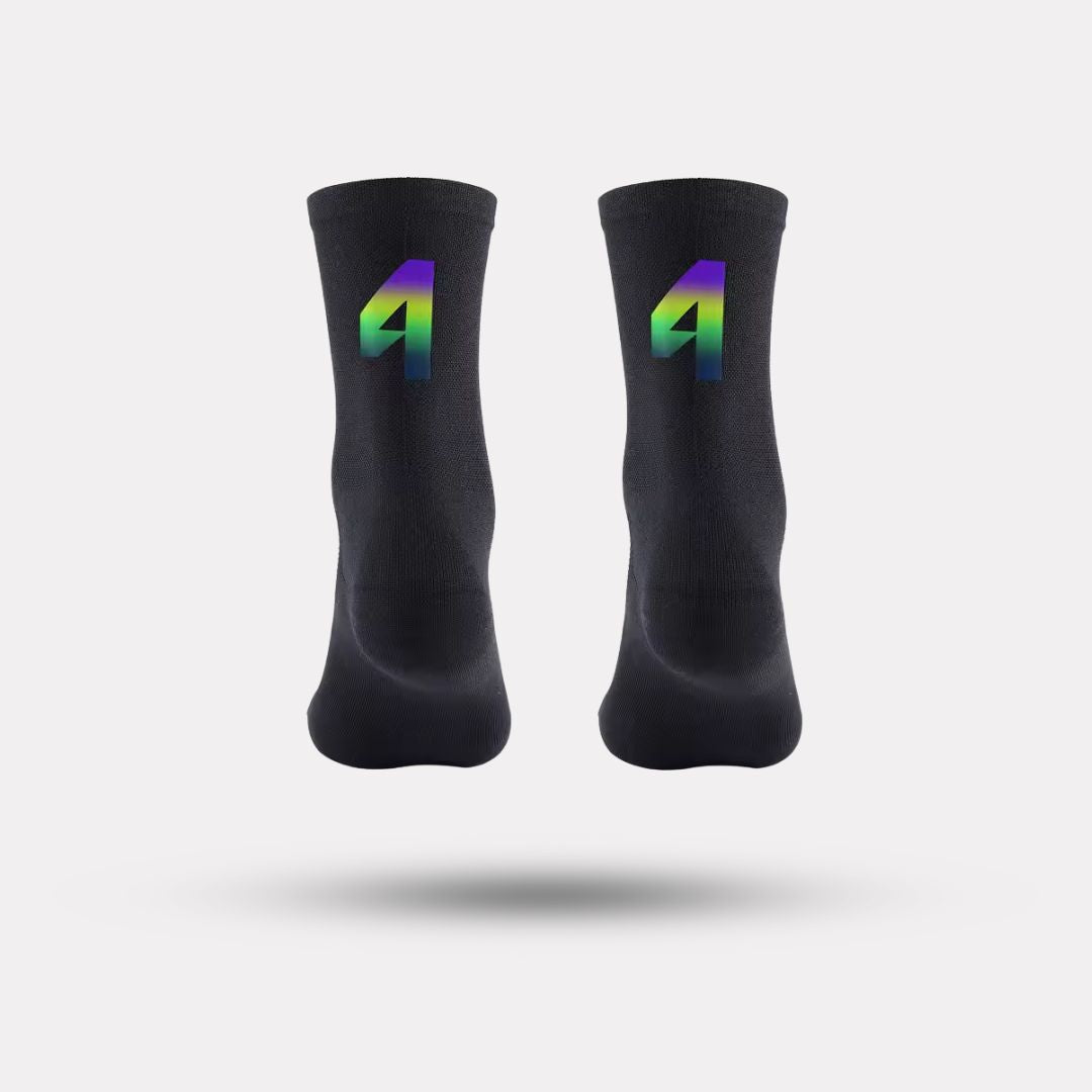 Black cycling socks with reflective stripes, worn high on the calf