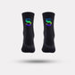 Black cycling socks with reflective stripes, worn high on the calf
