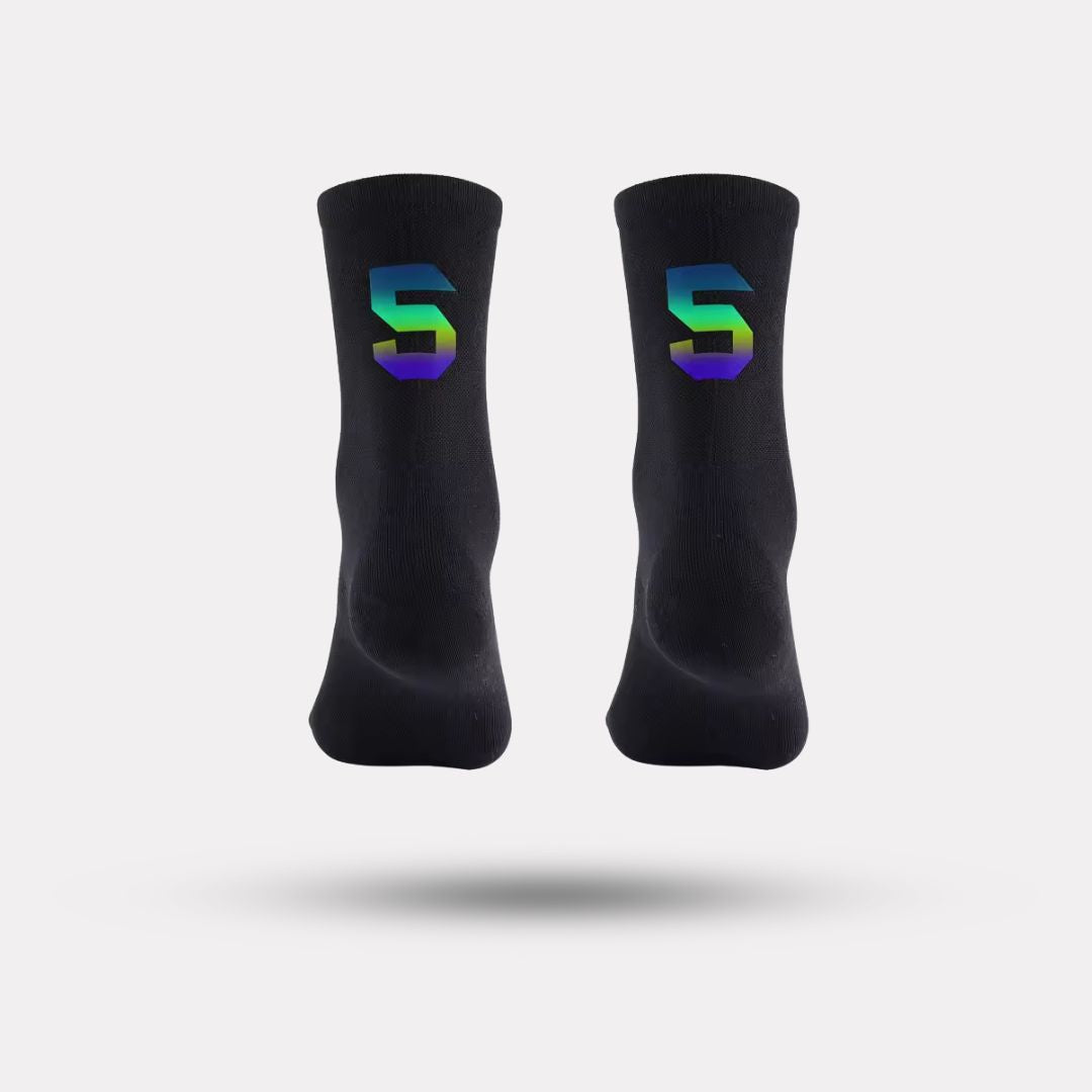Black cycling socks with reflective stripes, worn high on the calf
