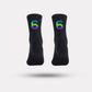 Black cycling socks with reflective stripes, worn high on the calf