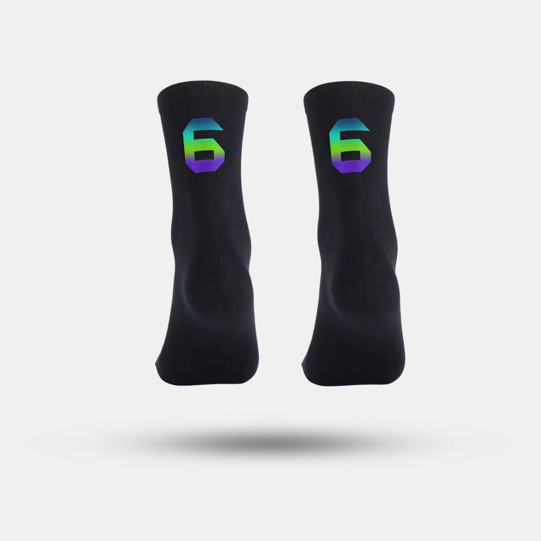 Black cycling socks with reflective stripes, worn high on the calf