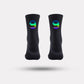 Black cycling socks with reflective stripes, worn high on the calf