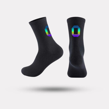 Black cycling socks with reflective stripes, worn high on the calf