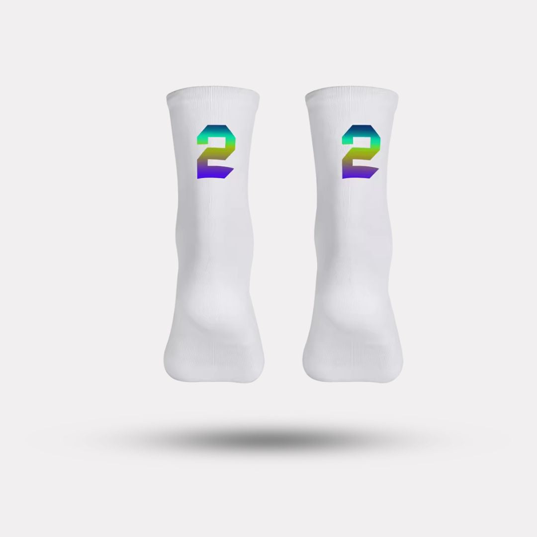 Black cycling socks with reflective stripes, worn high on the calf