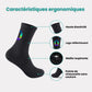 Black cycling socks with reflective stripes, worn high on the calf