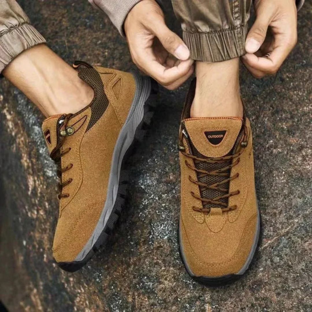 Dark gray hiking shoes with a lugged rubber outsole and a padded ankle collar