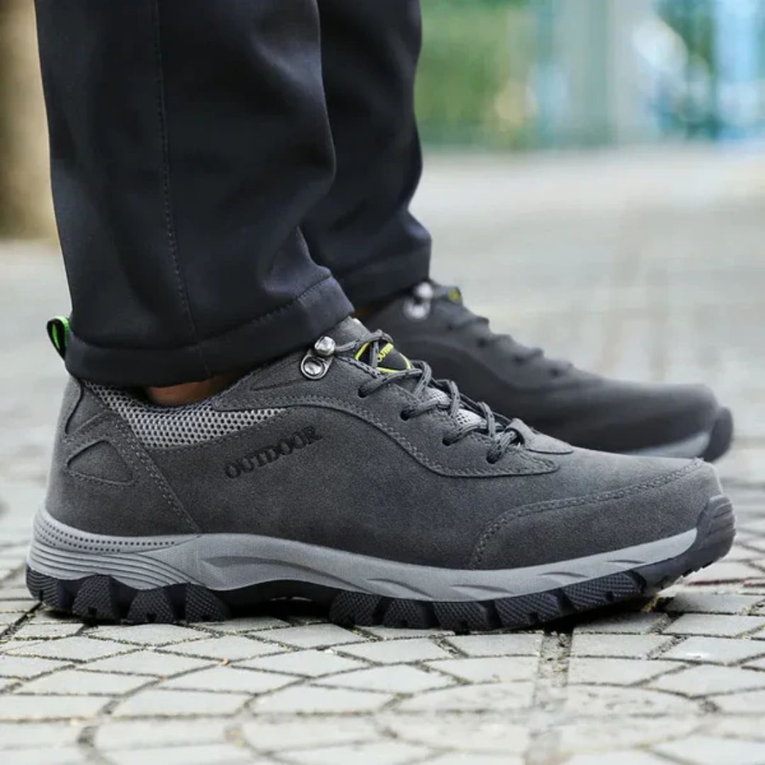 Dark gray hiking shoes with a lugged rubber outsole and a padded ankle collar