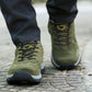 Dark gray hiking shoes with a lugged rubber outsole and a padded ankle collar