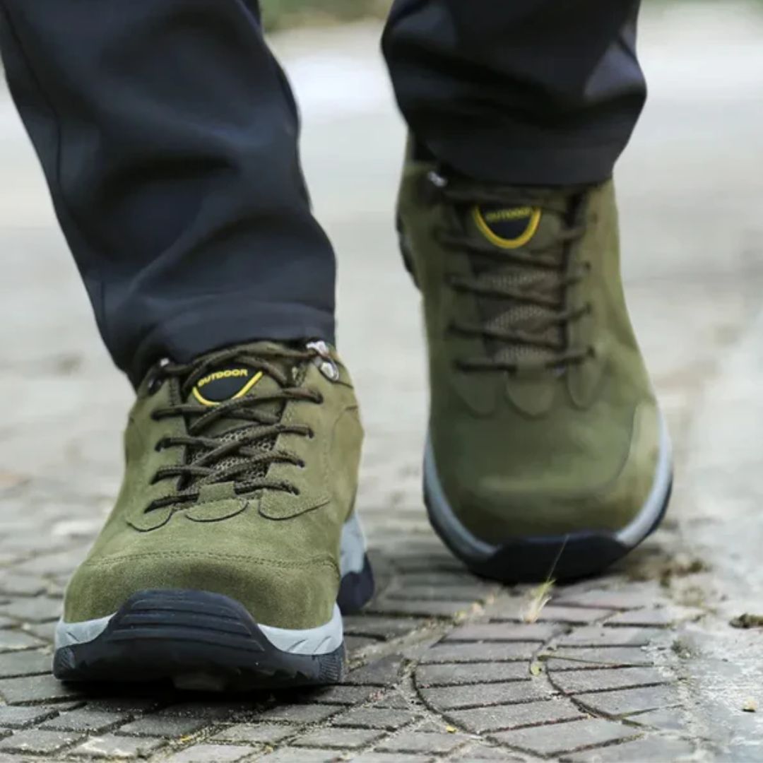 Dark gray hiking shoes with a lugged rubber outsole and a padded ankle collar