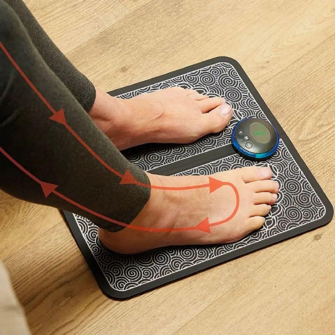 Flat EMS foot massager mat with electrode pads that the soles of the feet rest on