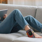 Padded heated foot massager with an open chamber that both feet slide into
