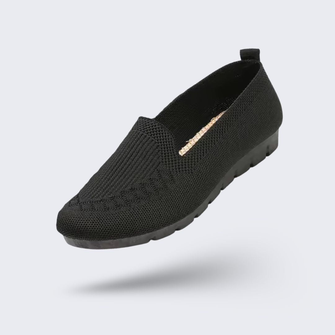 Black orthopedic flats for women with a soft rounded toe and padded insole