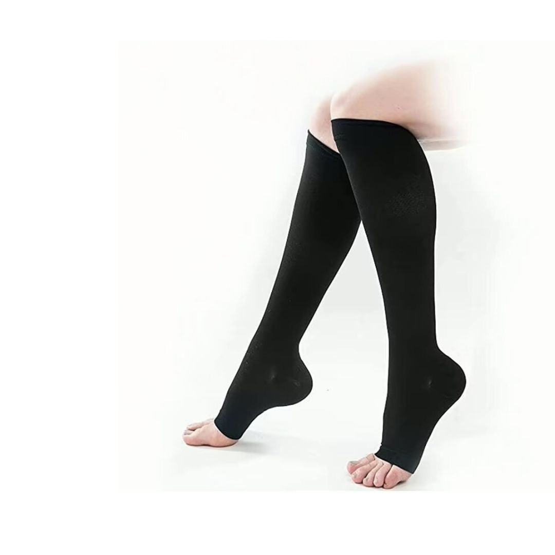 Knee-high compression stockings in nude and black, ending just below the knee