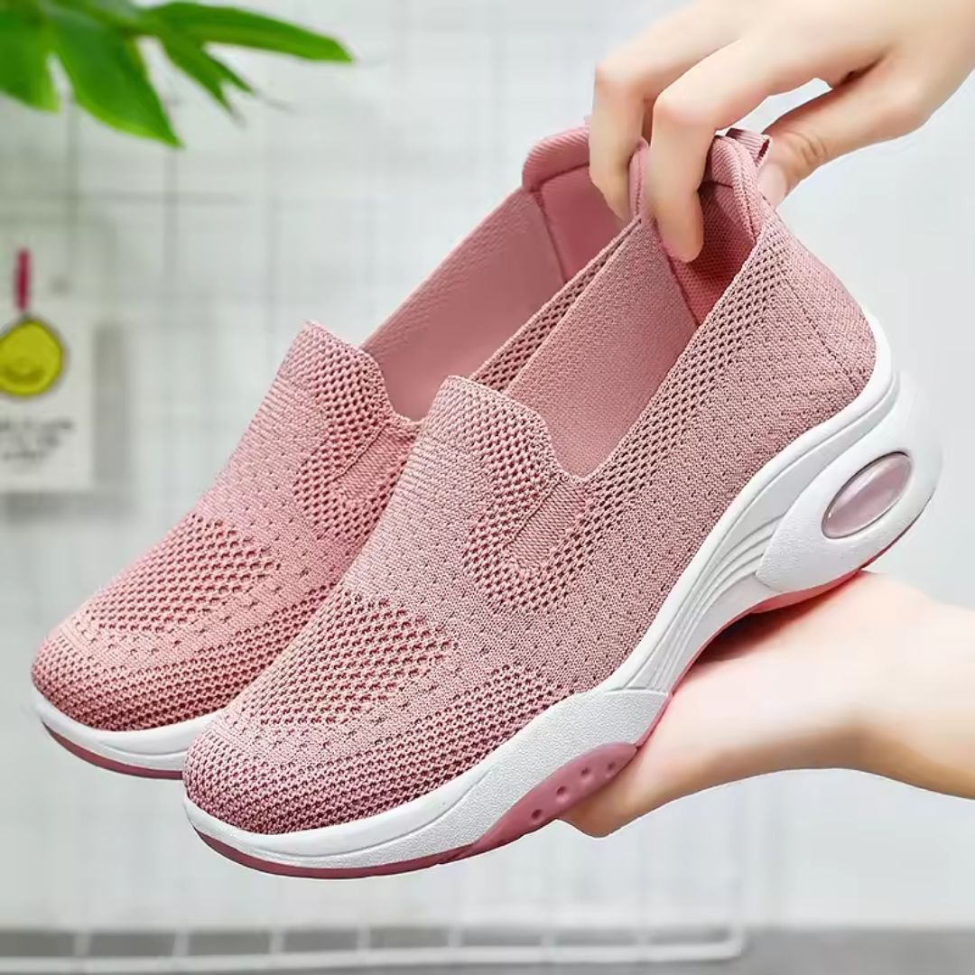 Pink orthopedic sneakers with a soft knit upper and cushioned arch support