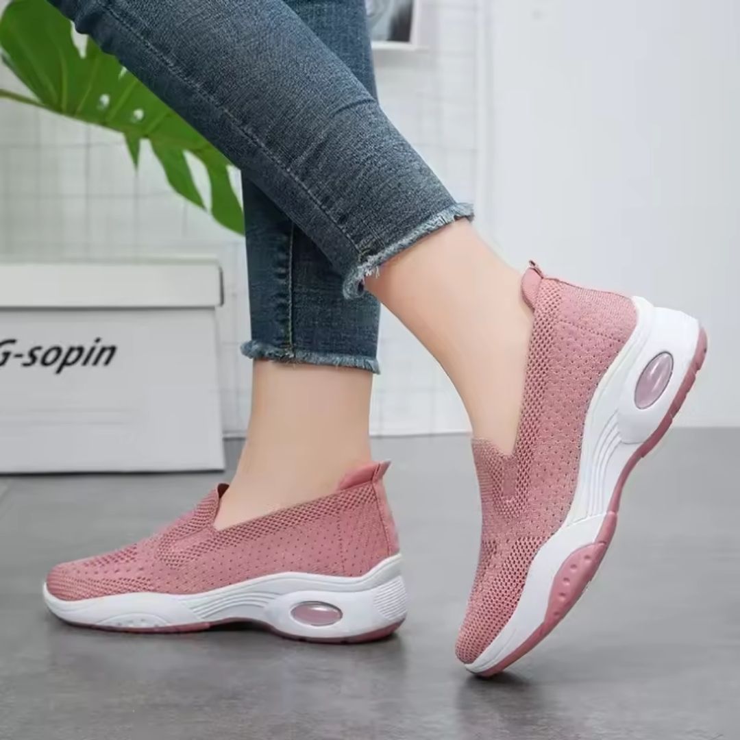 Pink orthopedic sneakers with a soft knit upper and cushioned arch support