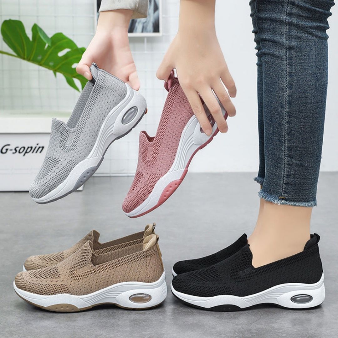 Pink orthopedic sneakers with a soft knit upper and cushioned arch support