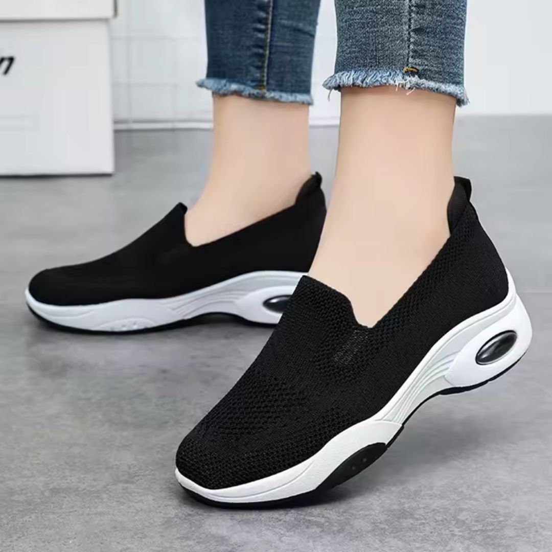 Pink orthopedic sneakers with a soft knit upper and cushioned arch support