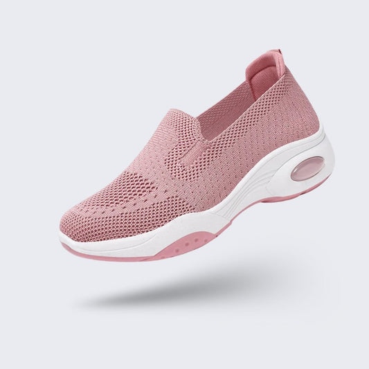 Pink orthopedic sneakers with a soft knit upper and cushioned arch support