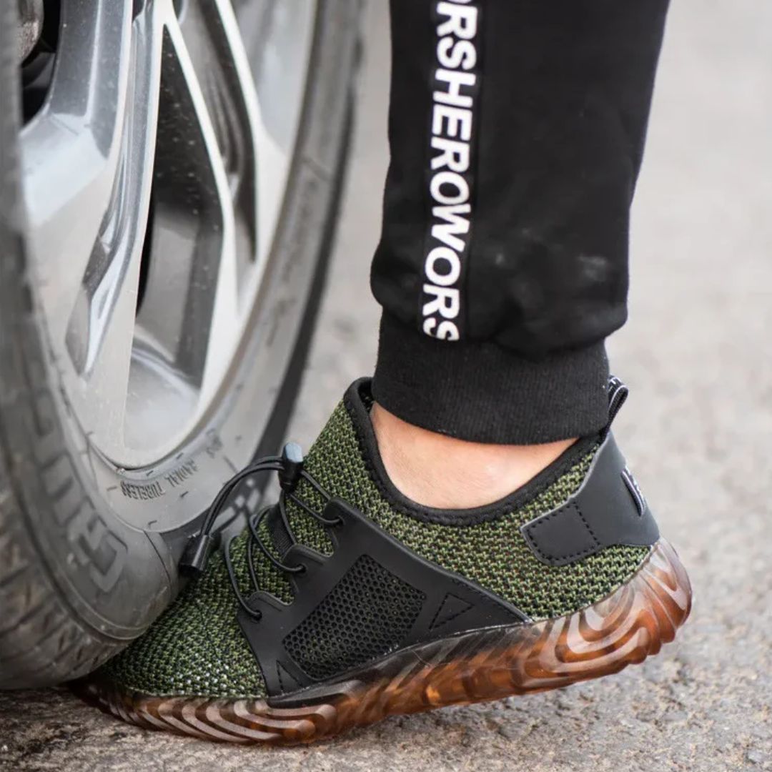 Gray breathable mesh safety sneakers with a protective toe and lace-up front