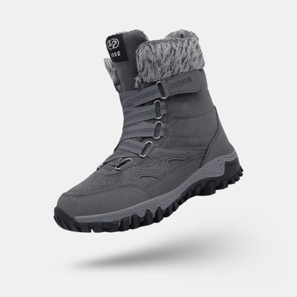Burgundy waterproof snow boots with a fleece lining and a grippy treaded sole