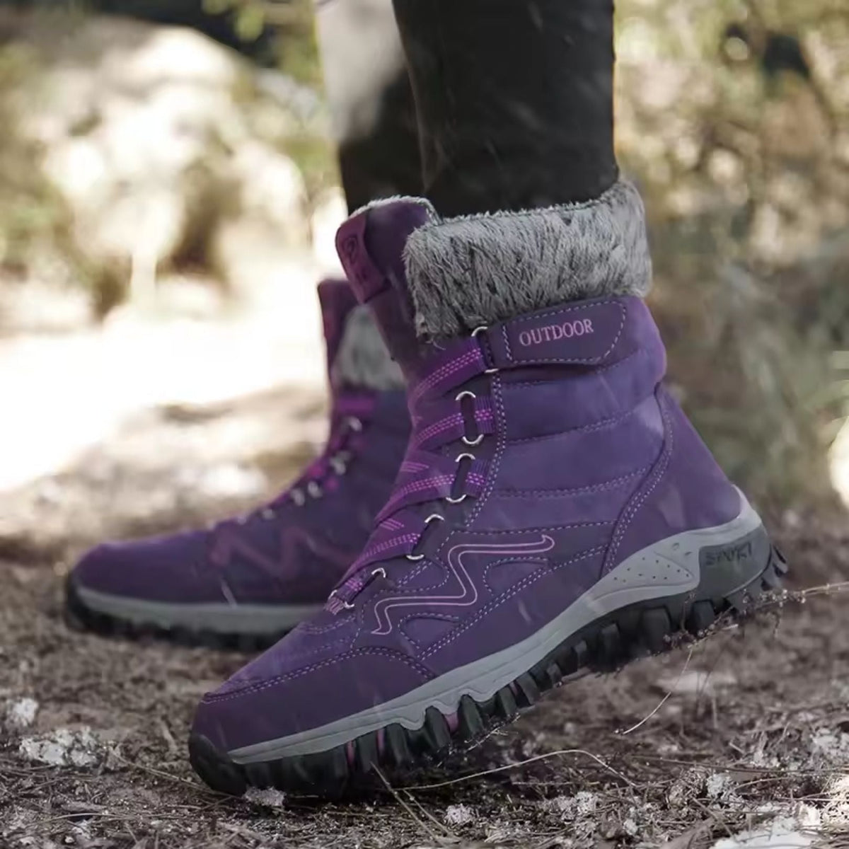 Burgundy waterproof snow boots with a fleece lining and a grippy treaded sole