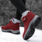 Black fleece lined orthopedic boots reaching just above the ankle
